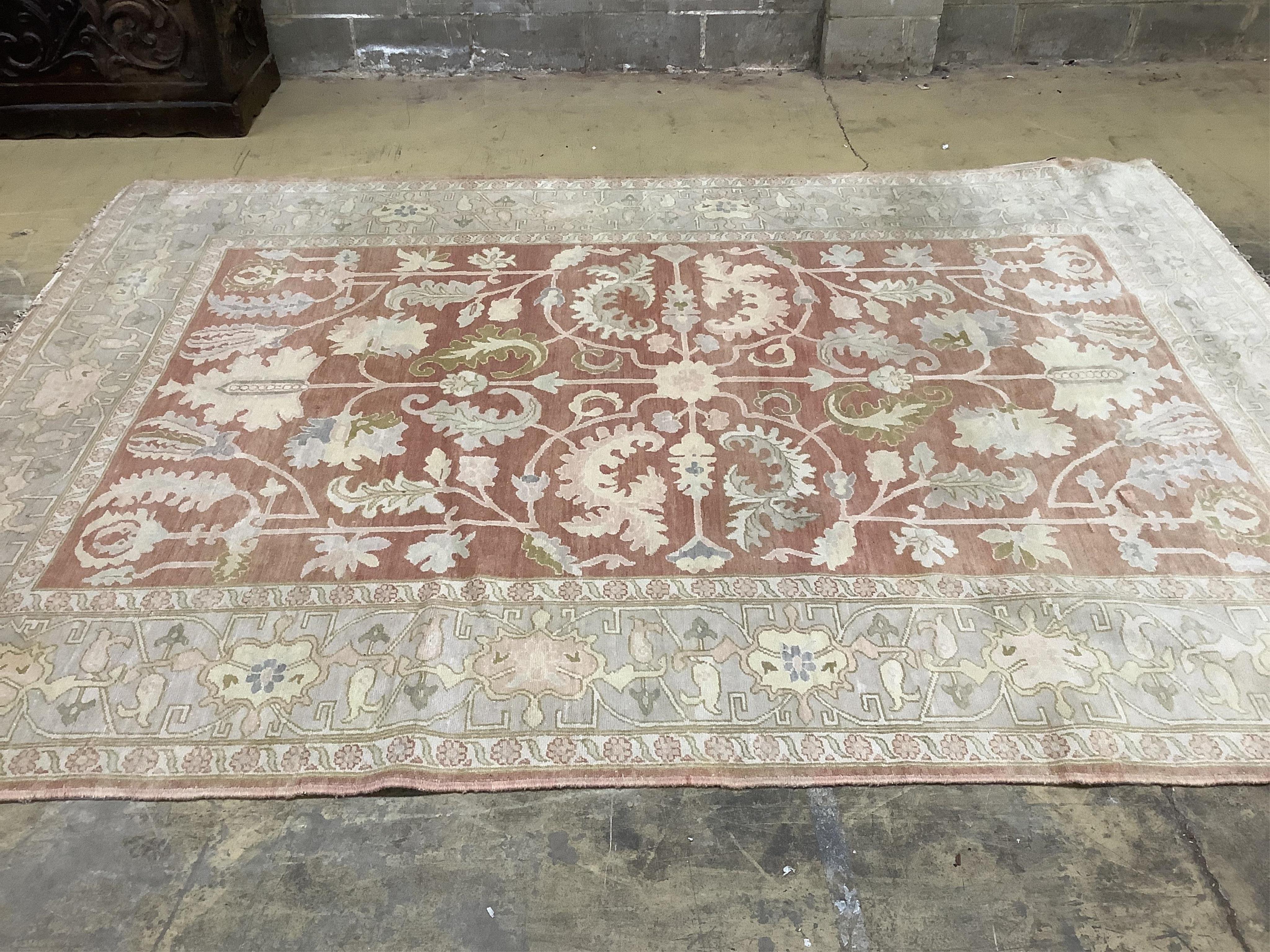 A Zeigler style pale red ground carpet, 340 x 250cm. Condition - fair